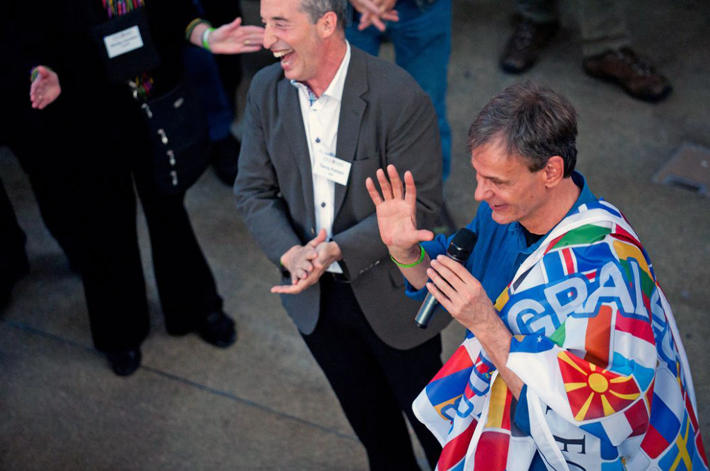 Jeff thanking the attendees after receiving a flag of all the European nations as a gift from the European integral community to the US.